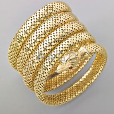 Appraisal: SPRUNG GOLD MESH SERPENT ARMLET Loop coiled serpent with red