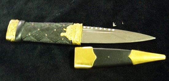 Appraisal: A gilt metal mounted sgian dubh the carved basketweave handle