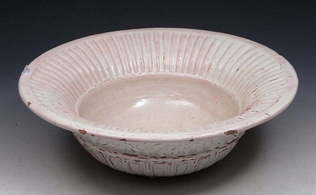 Appraisal: AN ITALIAN WHITE GLAZED FAIENCE BASIN with fluted rim cm