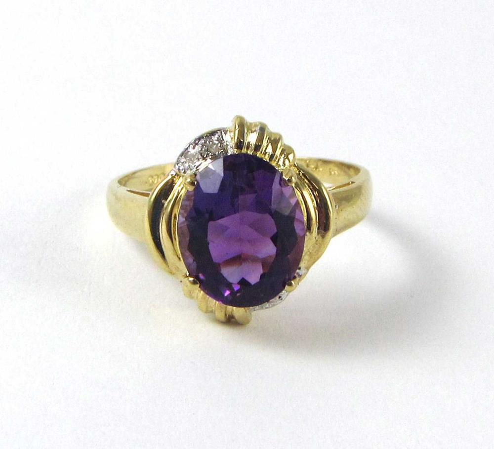 Appraisal: AMETHYST DIAMOND AND FOURTEEN KARAT GOLD RING with a pair