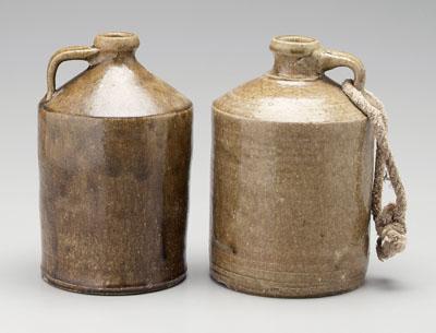 Appraisal: Two Timmerman stoneware whiskey jugs both alkaline glaze cylindrical with