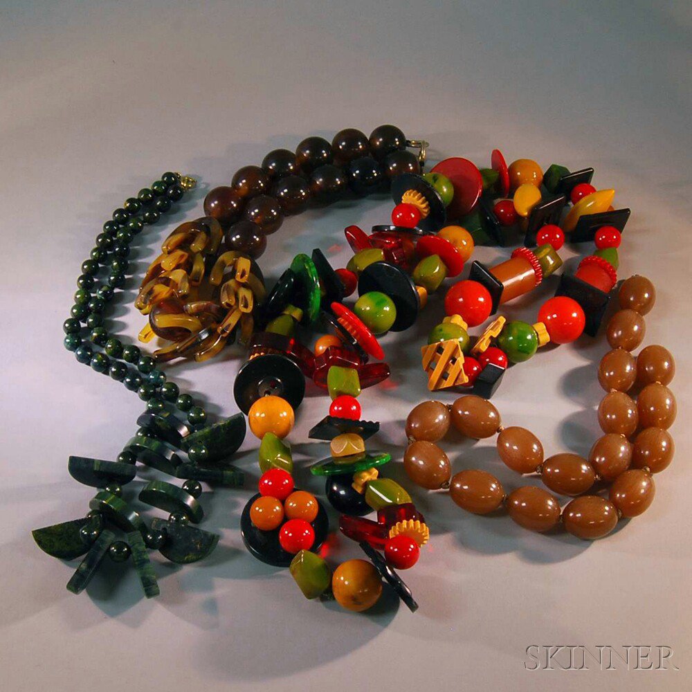 Appraisal: Four Bakelite Necklaces one very large multicolored necklace with beads