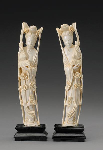 Appraisal: A pair of carved ivory beauties th Century Each emptying