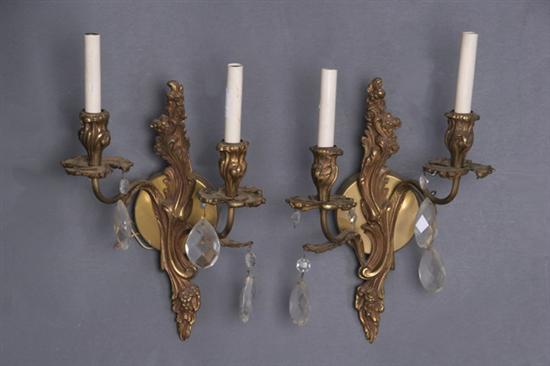 Appraisal: PAIR GILT-BRONZE AND CRYSTAL TWO-LIGHT WALL SCONCES early th century