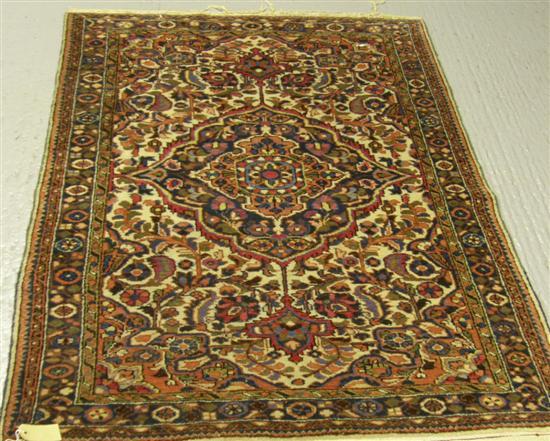 Appraisal: Persian cream-ground rug with multiple borders main central floral medallion