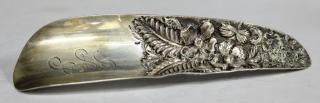 Appraisal: Circa the handle end heavily decorated with flowers and foliage