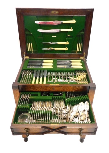 Appraisal: A freestanding oak cased canteen of silver plated cutlery King's