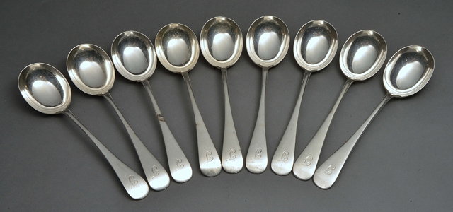 Appraisal: A SET OF NINE SILVER SOUP SPOONS Sheffield makers mark