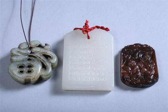 Appraisal: TWO CHINESE JADE PENDANTS One white jade with calligraphy one