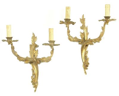 Appraisal: Two pairs of gilt brass twin branch wall lights of