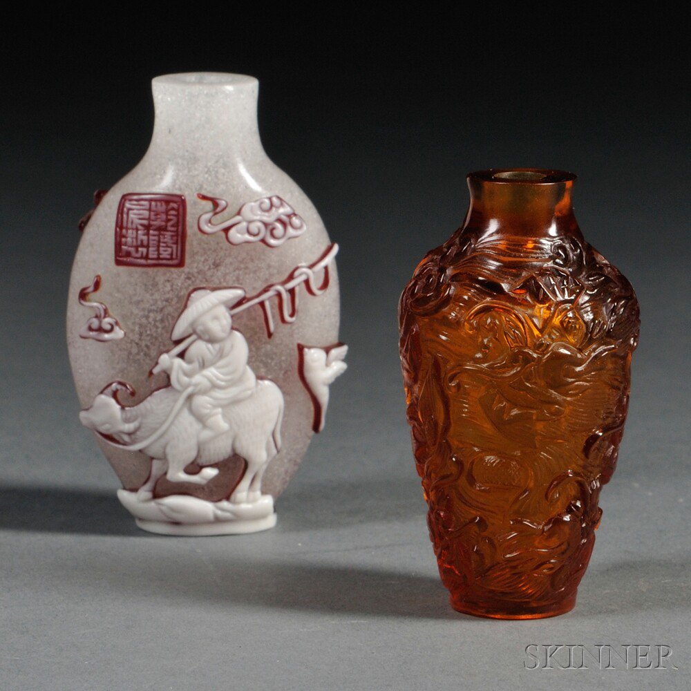 Appraisal: Two Glass Snuff Bottles China a baluster bottle of amber