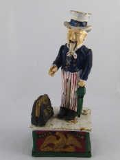 Appraisal: An Uncle Sam cast iron push button mechanical money box