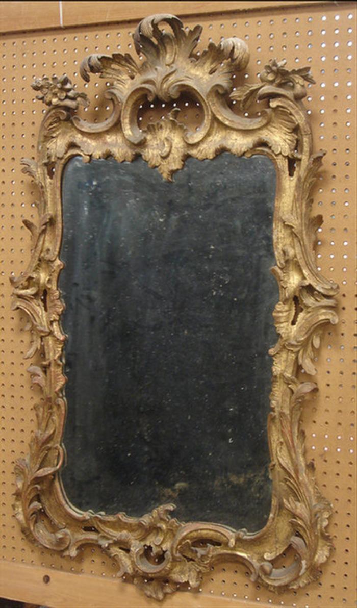 Appraisal: Carved and gilt Georgian Rococo wall mirror th c replaced