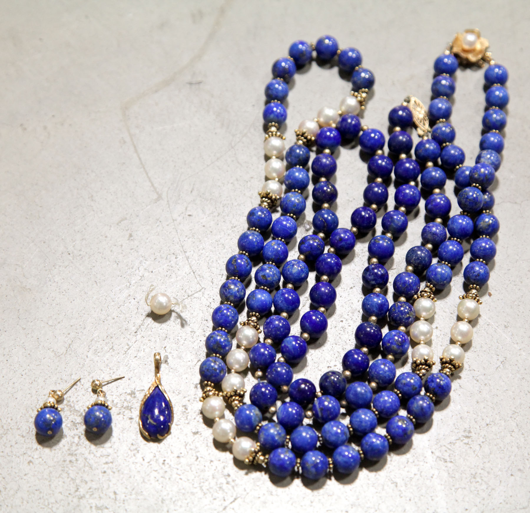 Appraisal: THREE PIECES JEWELRY American th century Two lapis and pearl