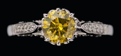 Appraisal: Fancy yellow diamond ring central round brilliant-cut diamond estimated weight