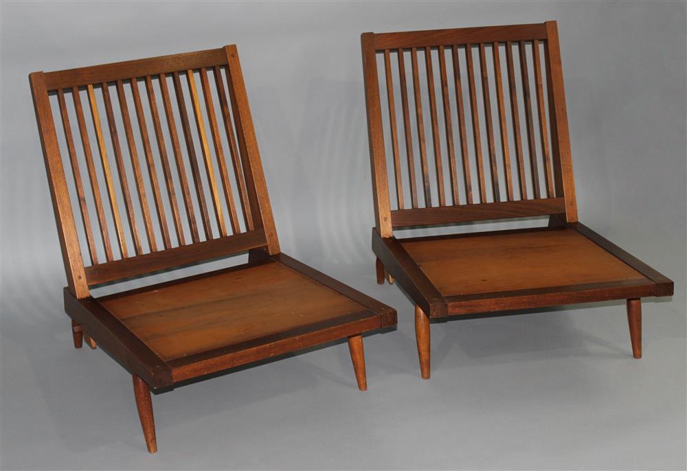 Appraisal: GEORGE NAKASHIMA PAIR OF BLACK WALNUT SPINDLE-BACK ARMLESS LOUNGE CHAIRS