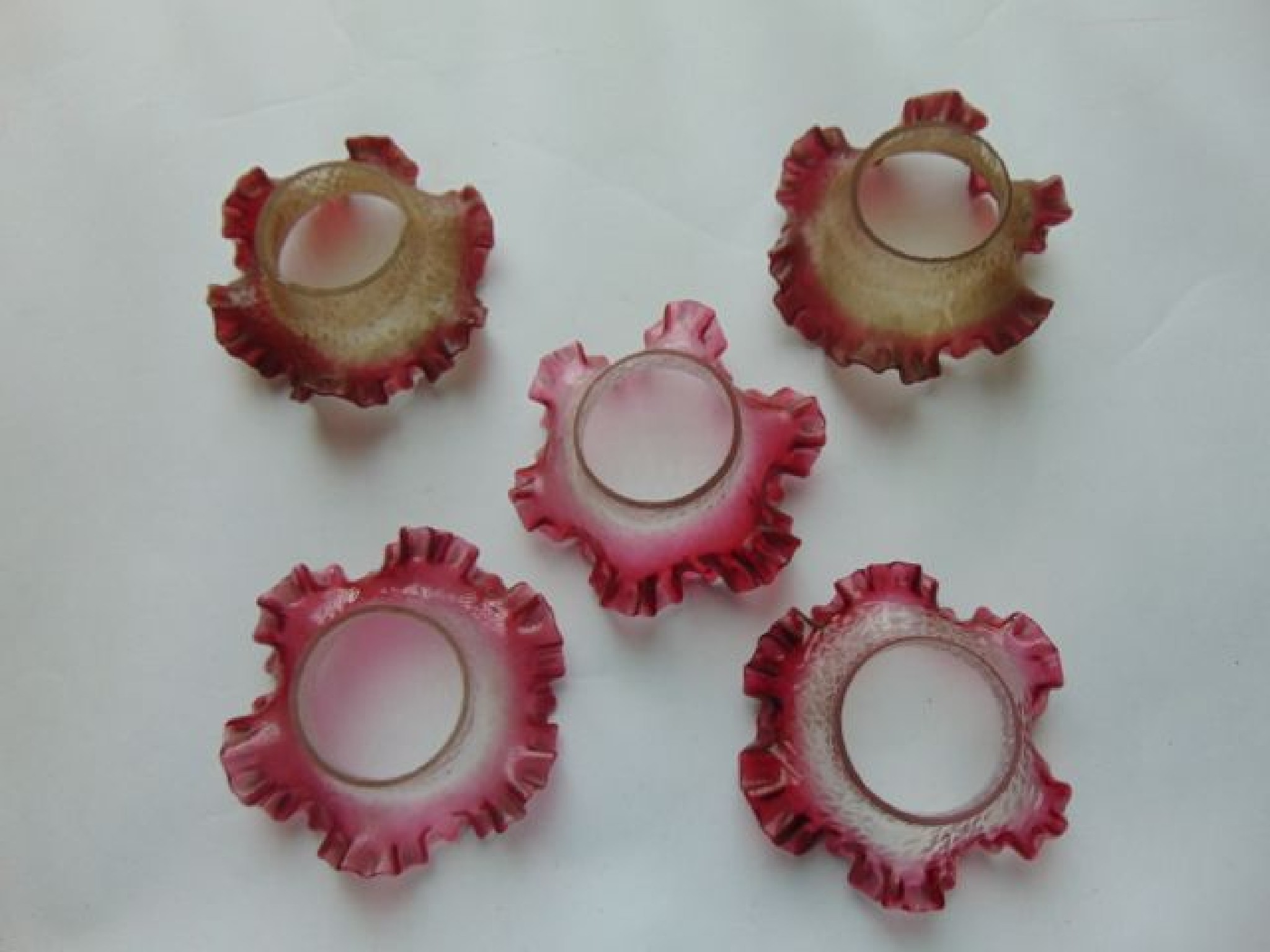 Appraisal: Five small Victorian glass lamp shades with cranberry tinted flared