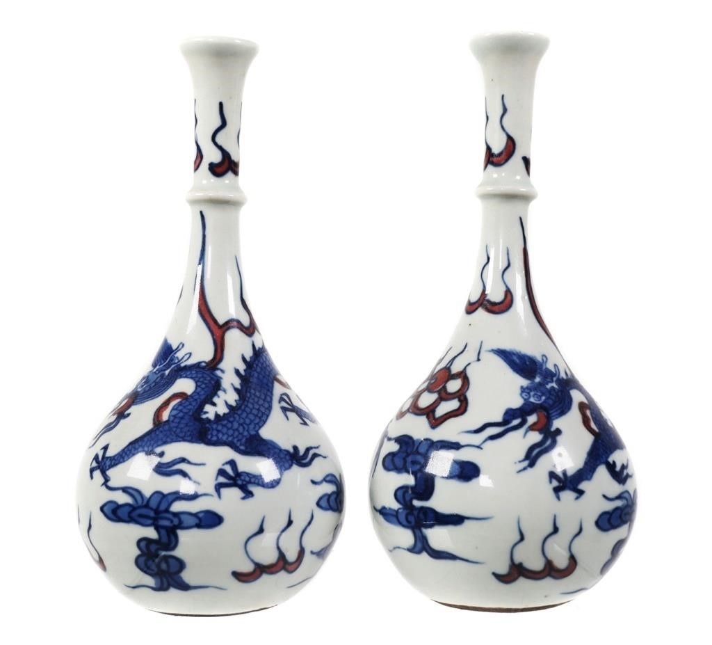 Appraisal: Pair of white porcelain Chinese bottle vases with red and