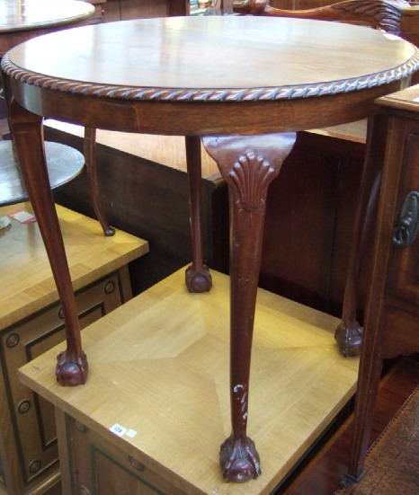 Appraisal: A th century circular mahogany occasional table raised on shaped