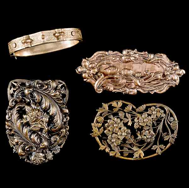 Appraisal: Unsigned Group of Brooches and a bangle A grouping of