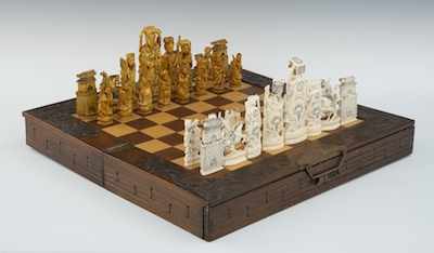 Appraisal: A Carved Ivory Chess Set and Game Board Box Consisting