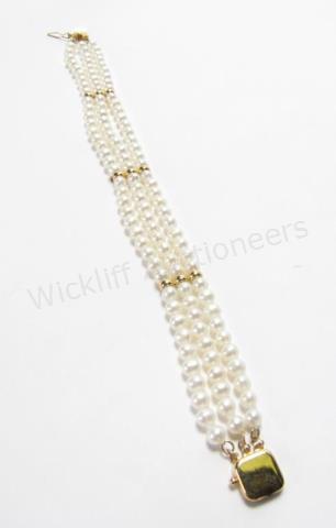 Appraisal: A K yellow gold triple strand pearl bracelet pearls to