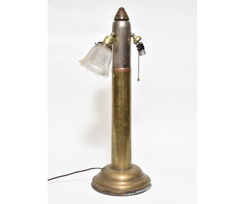 Appraisal: Large Brass Artillery Shell Lamp Large brass artillery shell converted