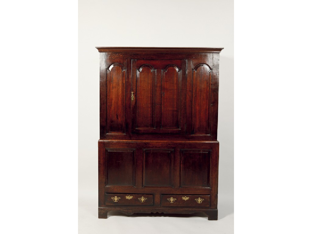 Appraisal: A GEORGE III OAK LIVERY CUPBOARD the upper section with