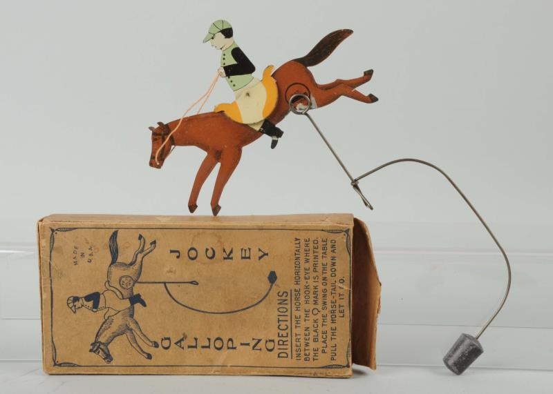 Appraisal: Tin Litho Gallopng Jockey Toy Box Normal paint loss where