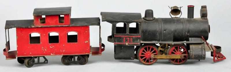 Appraisal: Carlisle Finch Train Locomotive Caboose Description American -inch gauge Includes