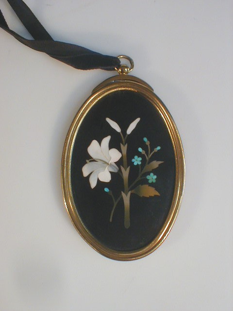 Appraisal: A Victorian pietra dura oval pendant plaque depicting lilies and