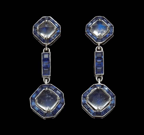 Appraisal: A pair of moonstone and sapphire drop earrings mounted in