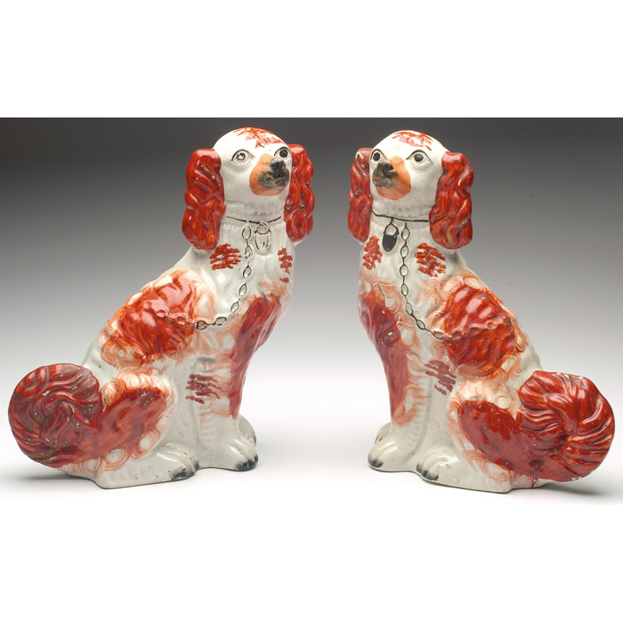 Appraisal: Staffordshire figurals pair spaniels in an orange and ivory matte