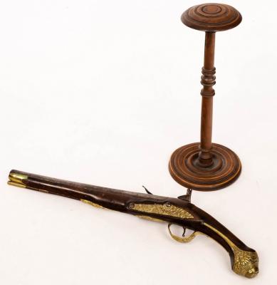 Appraisal: A brass mounted flintlock pistol and a turned and inlaid