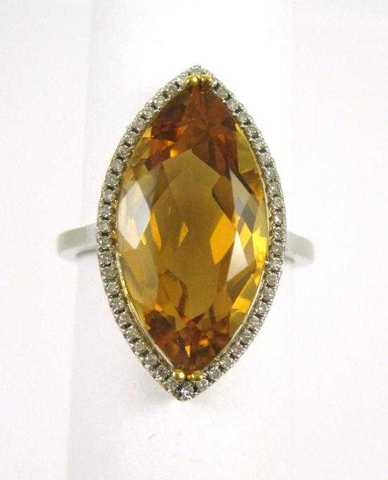 Appraisal: CITRINE DIAMOND AND FOURTEEN KARAT WHITE GOLD RING with round-cut