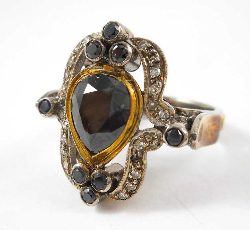 Appraisal: INDIA BLACK DIAMOND SILVER AND GOLD RING The sterling silver