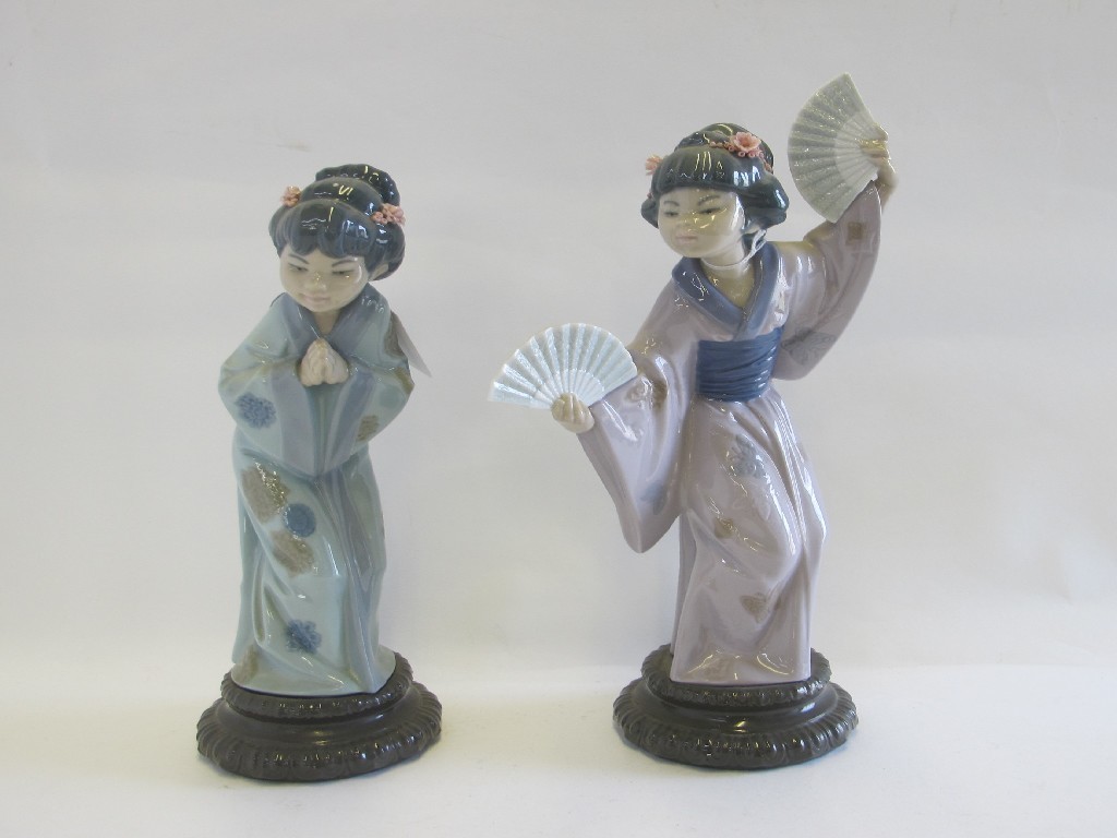 Appraisal: Two Lladro figures 'Japanese with Fan' and 'Japanese Sayonara'