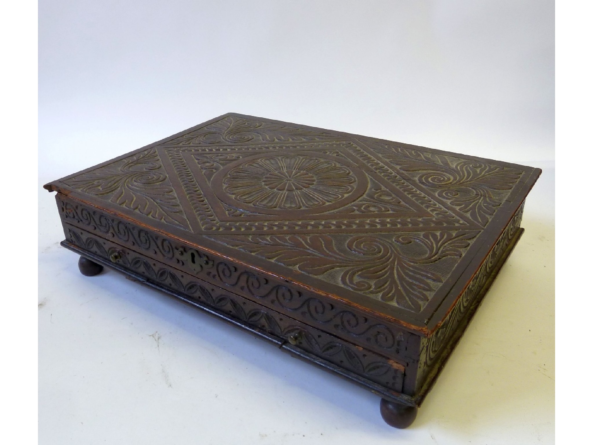 Appraisal: AN EIGHTEENTH CENTURY CARVED OAK SHALLOW BOX rectangular form with