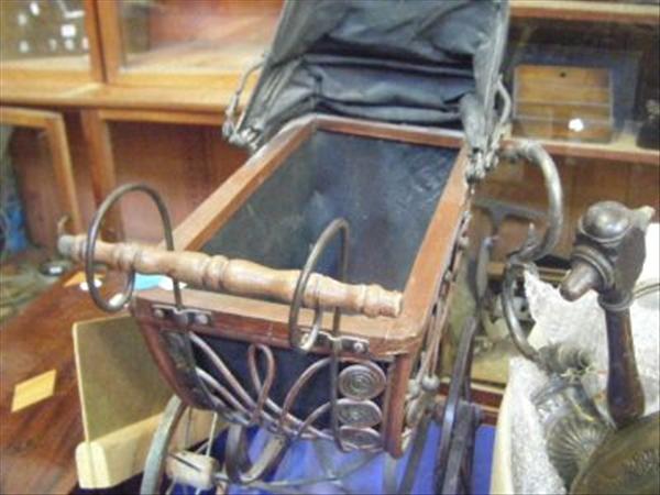 Appraisal: A bent wood doll's pram together with a box of