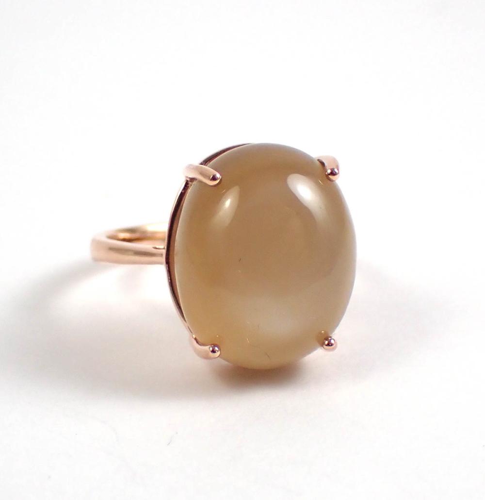 Appraisal: MOONSTONE AND FOURTEEN KARAT ROSE GOLD RING The solitaire ring