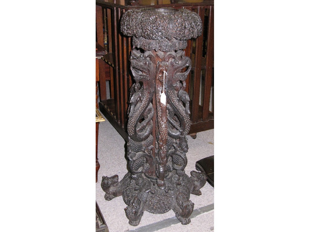 Appraisal: Eastern carved hardwood pedestal stand