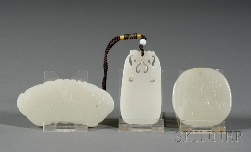 Appraisal: Three Jade Pendants celadon color a dragon the Ho Ho