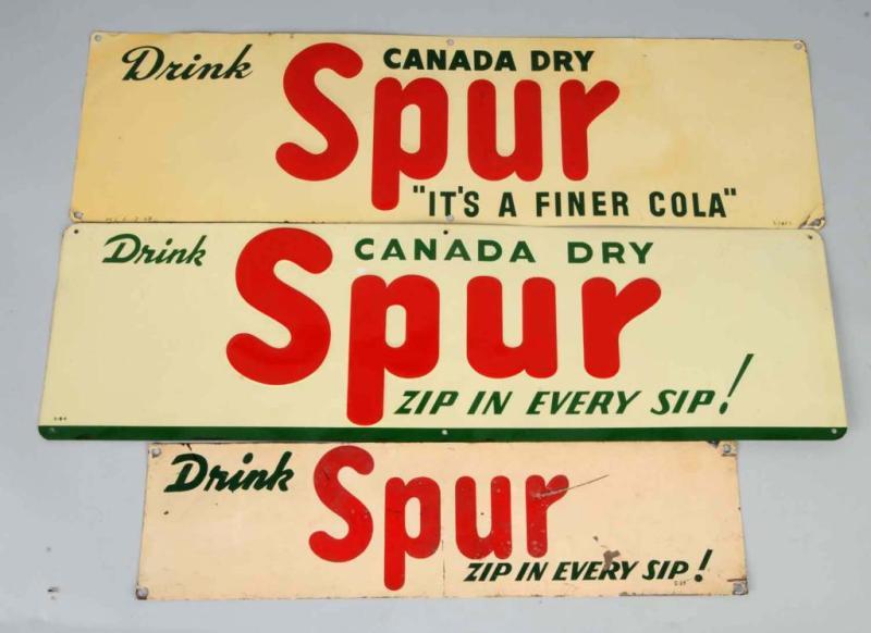 Appraisal: Lot of Tin Spur Signs Description The two larger signs