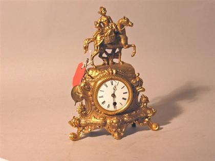 Appraisal: Gilt metal figural detailed mantel clock With a woman on