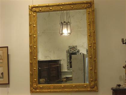 Appraisal: Neoclassical style giltwood wall mirror th century With a rectangular