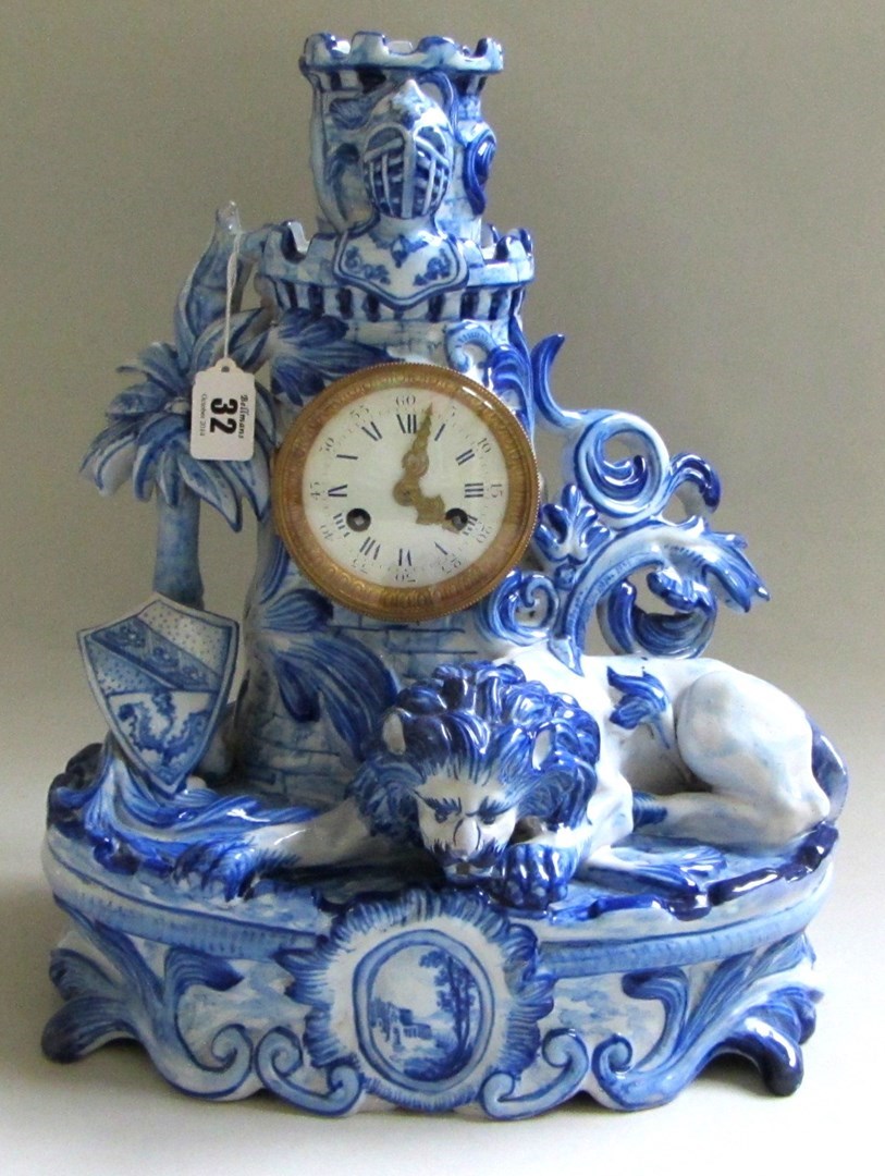 Appraisal: An Emile Galle style gilt metal mounted figural faience clock