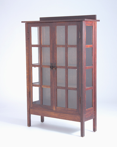 Appraisal: GUSTAV STICKLEY China cabinet with two doors and V-shaped copper