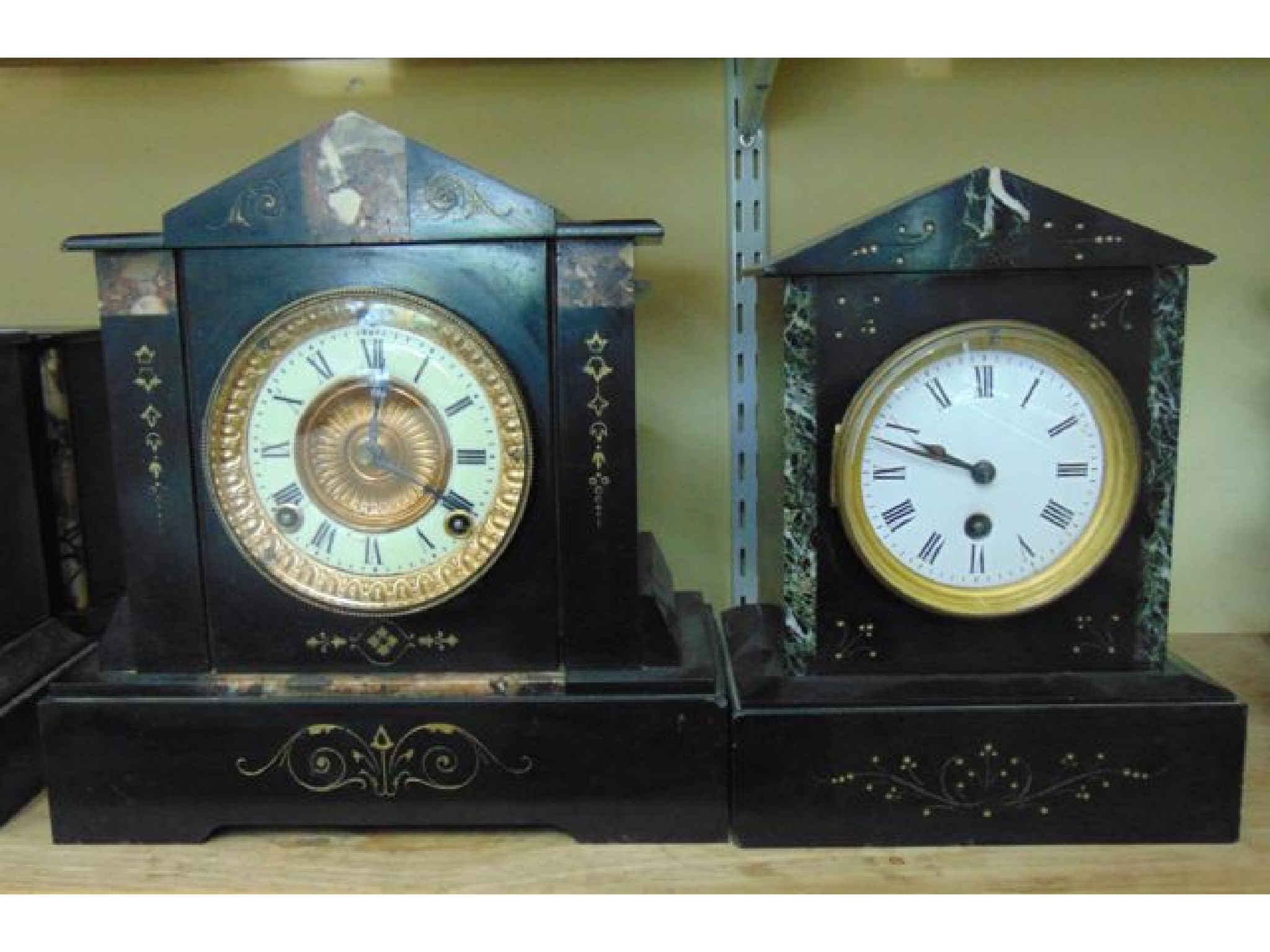 Appraisal: A Victorian black slate and marble mantle clock in the