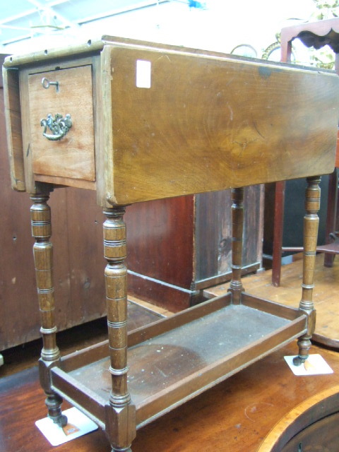 Appraisal: A late th century walnut and mahogany Sutherland table with