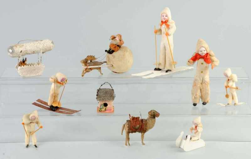 Appraisal: Lot of Cotton Figures Description Includes five skiers one Santa